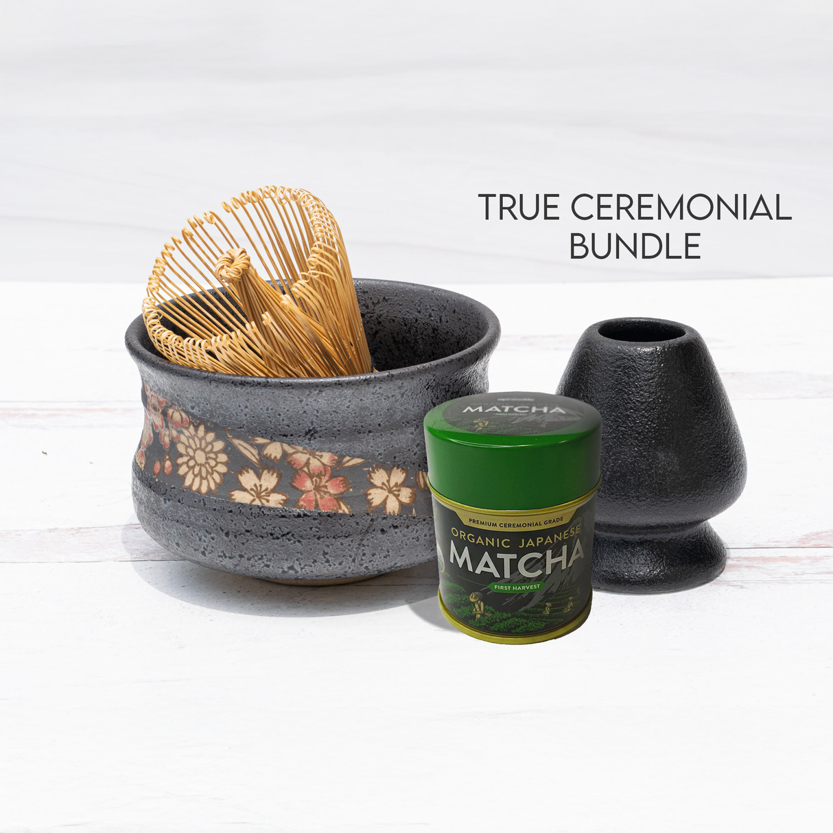 The "True Ceremonial Bundle" includes a Black with Flowers Matcha Bowl crafted in the traditional Minoyaki style, a whisk, a green matcha tin, and a holder.