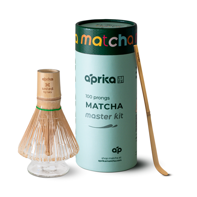 Explore the Matcha Bamboo Whisk & Holder Set, featuring a bamboo scoop and a premium matcha whisk, elegantly packaged in a sleek cylindrical design.