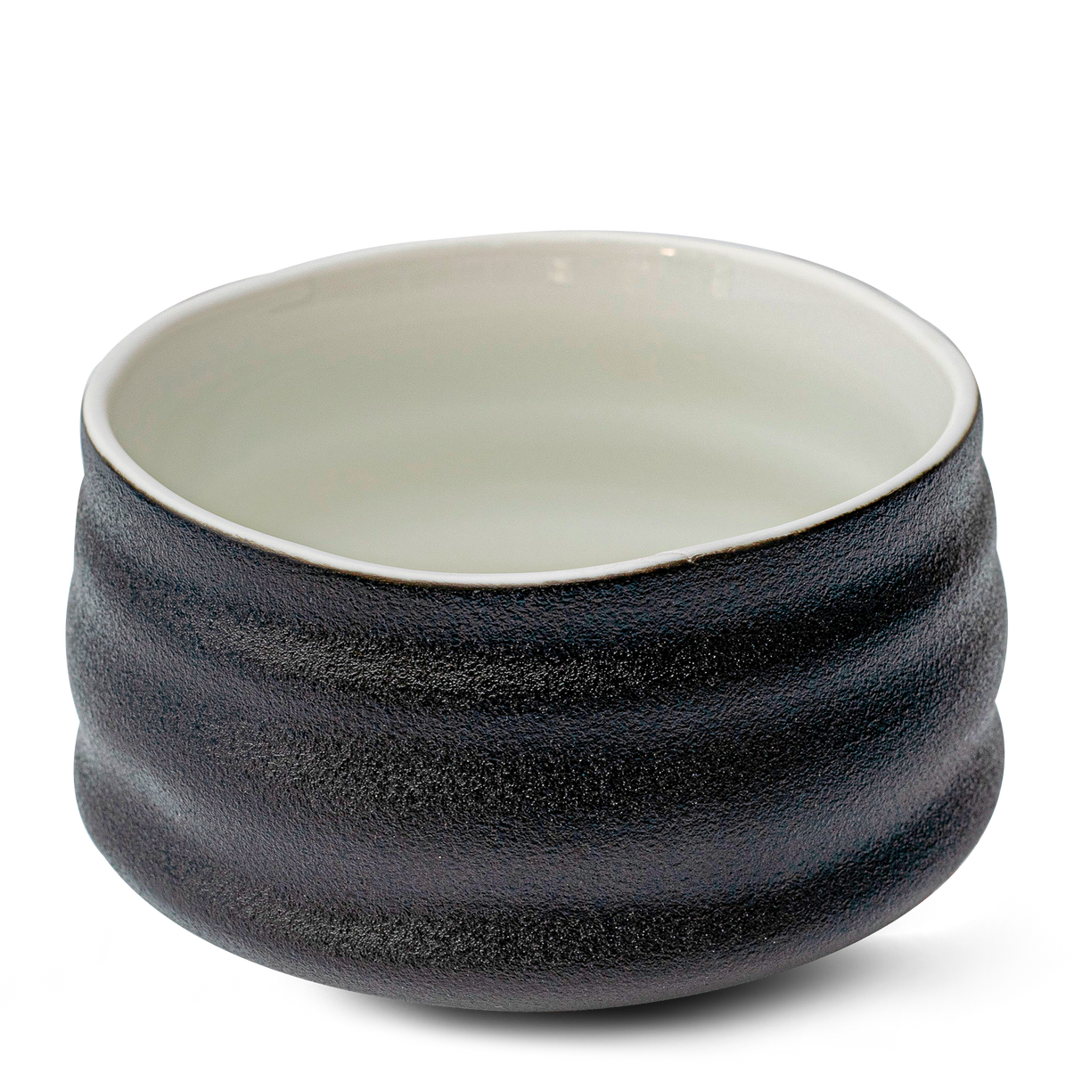 A Black and White Ceramic Matcha Bowl featuring a textured black exterior with a smooth white interior, capturing the essence of traditional Minoyaki pottery.