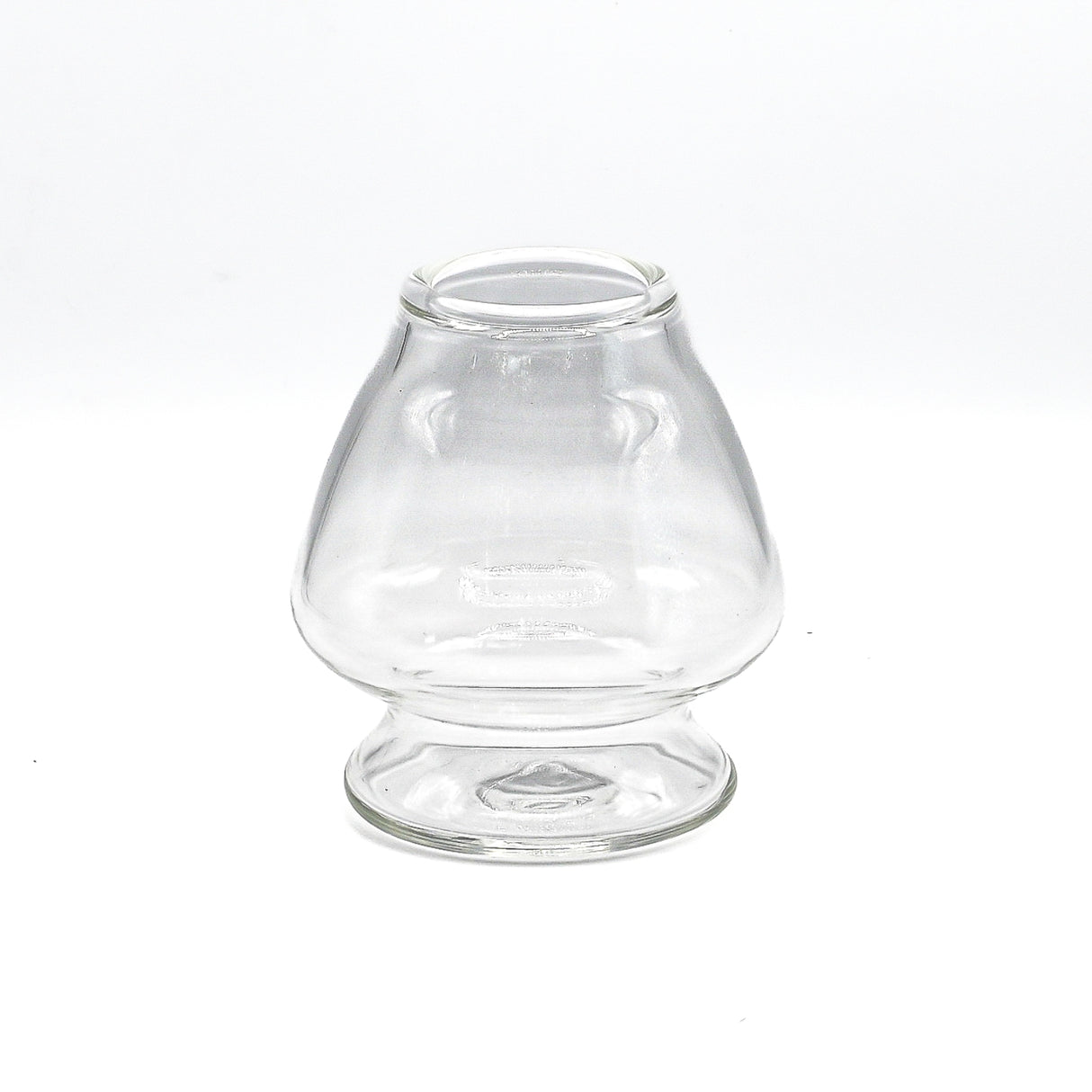 A transparent Double Sided Glass Bowl with a flared base and open top, designed for oil lamps, evokes the aesthetic of a matcha bowl.