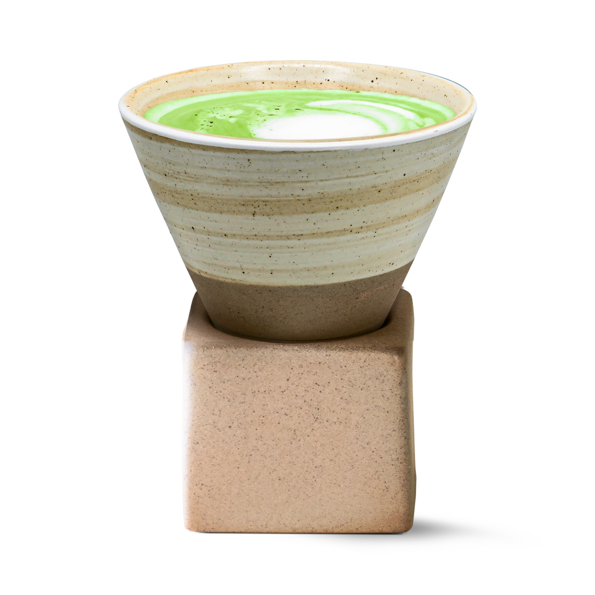 A Beige Coffee Mug with Base cradles a green and white matcha latte, elegantly resting on its square stone base.