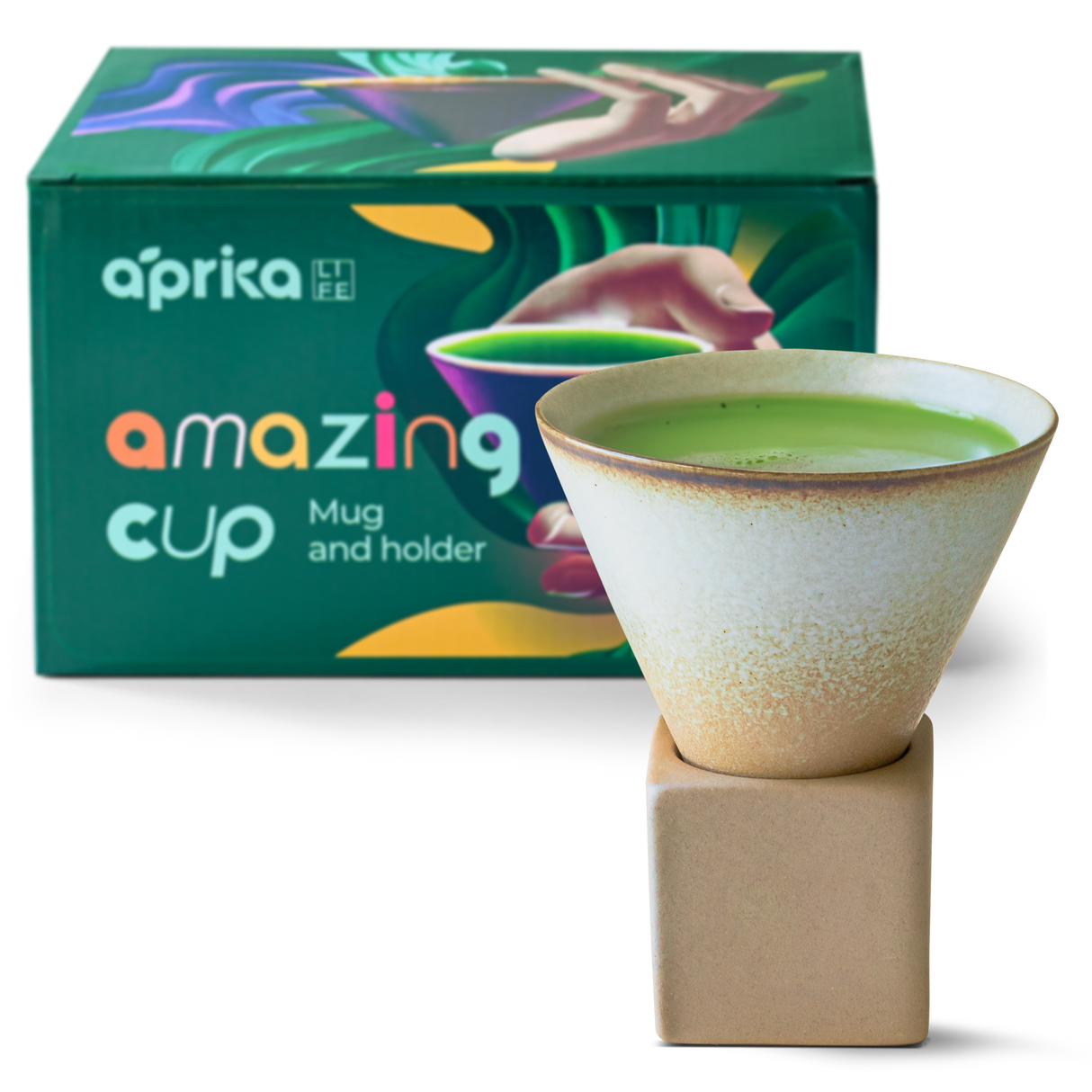 A ceramic mug filled with green liquid sits elegantly on a square holder, in front of a box labeled "Brown Coffee Mug with Base - 6.8 oz/200ml" by Aprika Life, showcasing exquisite artistry.