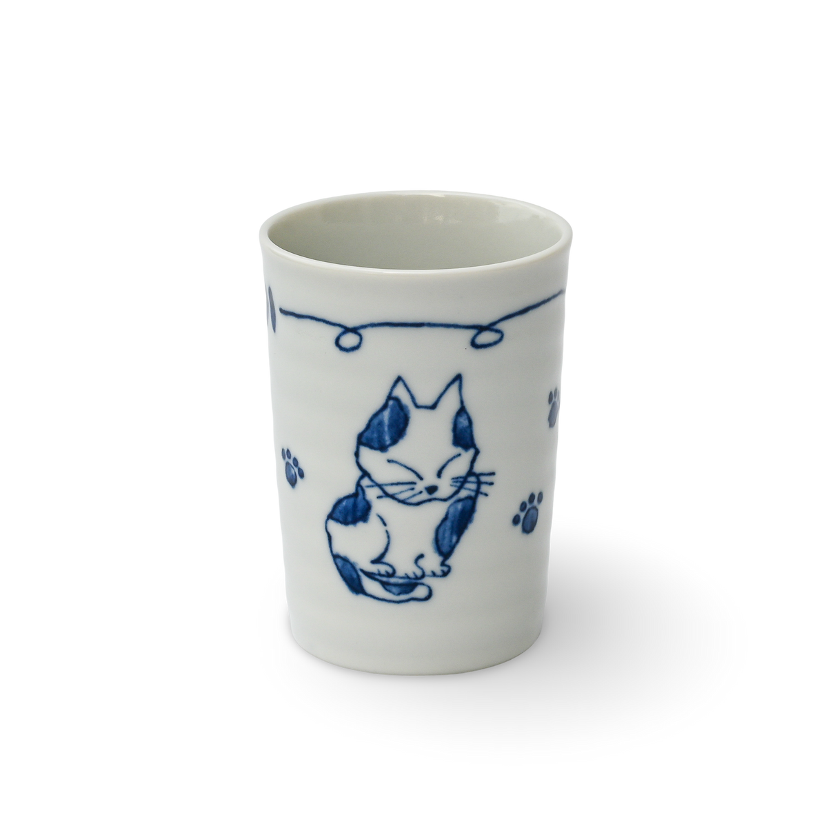 The Adorable Cat 3 Tea Cup is a white Mino-ware ceramic cup featuring blue cat illustrations and paw prints on a black background, reminiscent of Gifu Prefecture's traditional style. It holds 180ml (6oz.).
