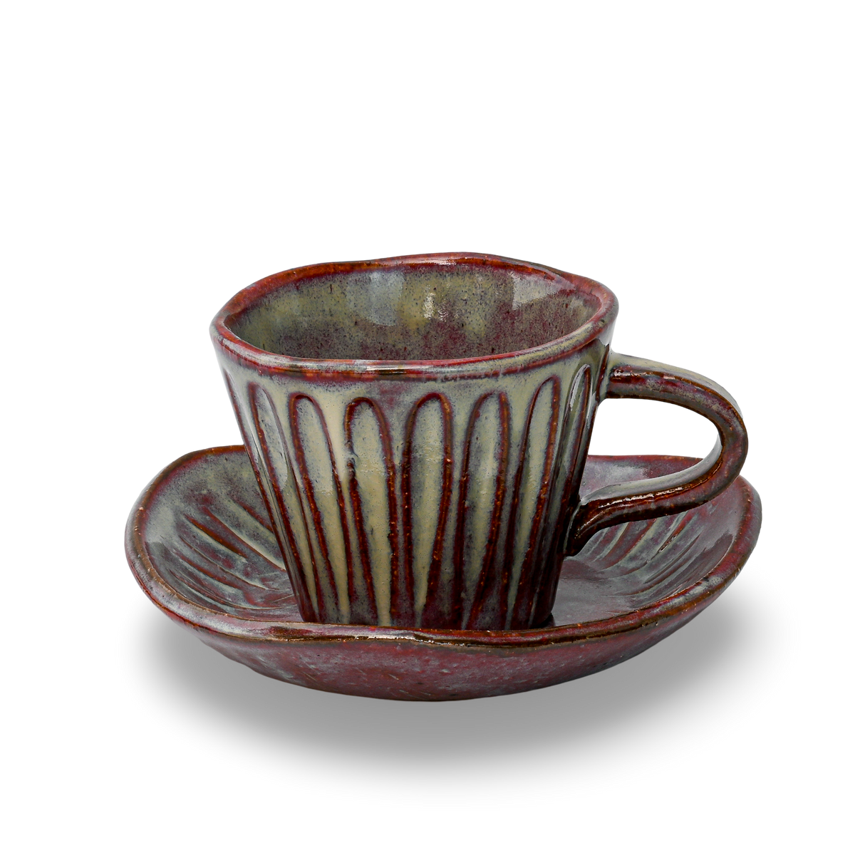 The Shibu Yunomi Japanese Tea Cup with Saucer, featuring vertical grooves and maroon and gray hues, rests elegantly against a black background, exemplifying Minoyaki pottery's timeless beauty and craftsmanship.