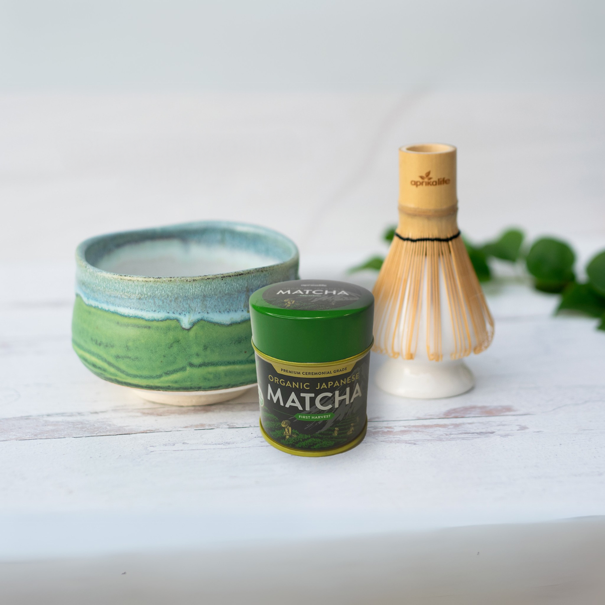The Iguchi Deep Sea Clay Matcha Bowl, Bamboo Matcha Whisk, Whisk Holder, and Organic Japanese Matcha Set is displayed on a white surface.