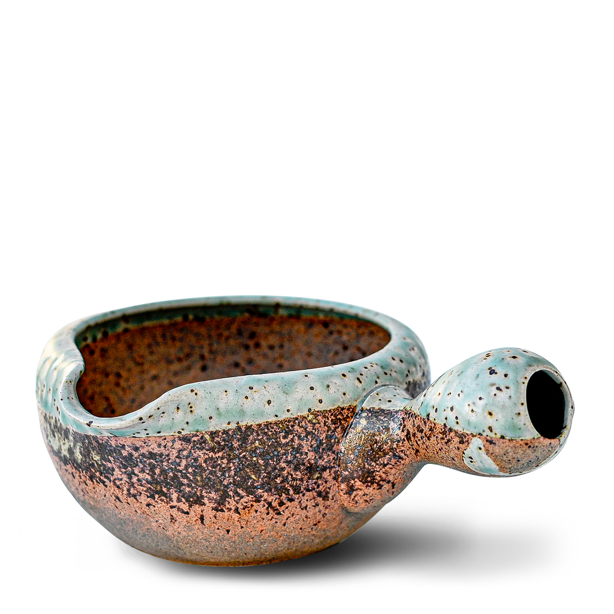 Ceramic pipe with a round bowl and handle, glazed in earthy speckled green and brown tones, reminiscent of the Brown Ceramic Matcha Bowl from the Organic Japanese Matcha Set.