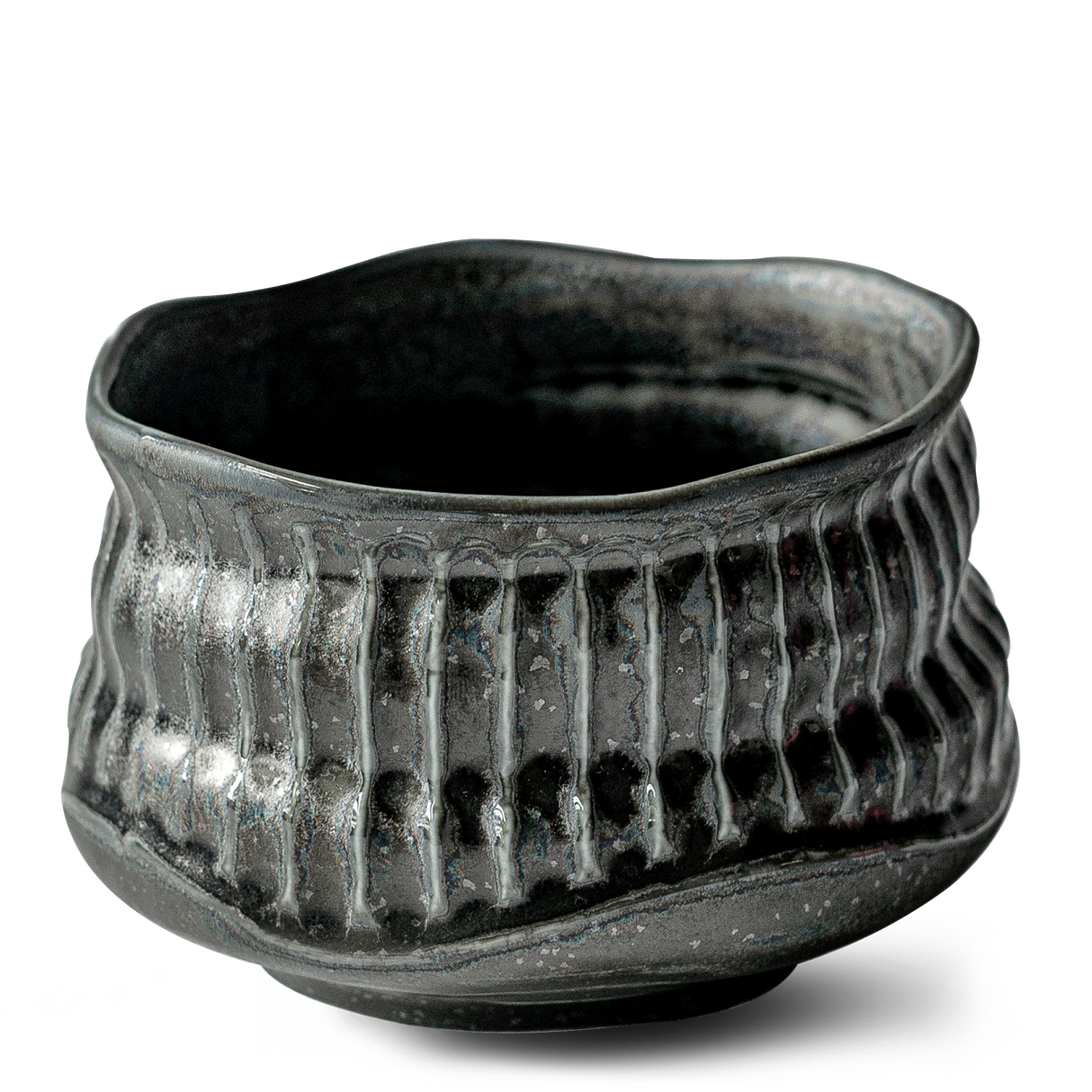 The Black Ceramic Meisen Matcha Bowl features a textured, wavy-rim design with vertical ridges and comes as part of a set with a bamboo matcha whisk, whisk holder, and organic Japanese matcha.