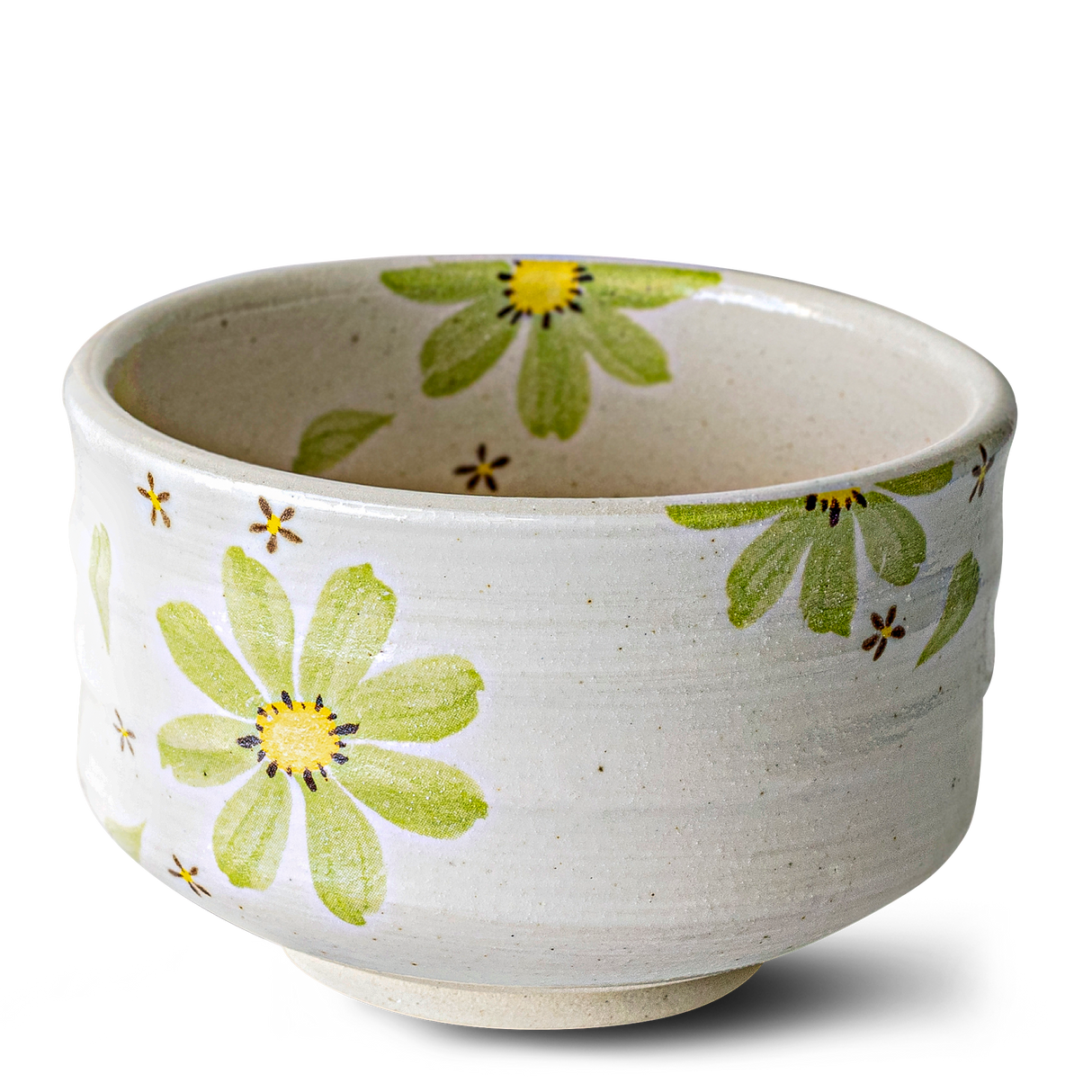 The Green Flowers Ceramic Matcha Bowl features a green and yellow floral design inspired by Japanese pottery and comes as part of the set with a bamboo whisk, whisk holder, and organic Japanese matcha.