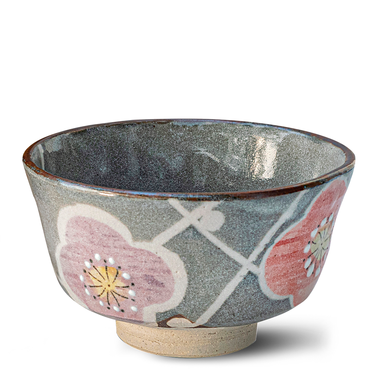The Gray with Flowers Ceramic Matcha Bowl Set includes a bamboo matcha whisk and holder—ideal for tea accessories or as part of a matcha starter set. Pink flowers and green leaves accent the gray ceramic bowl.