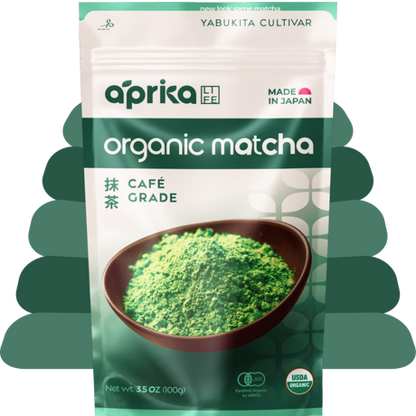 A green and white package of organic Japanese Matcha Green Tea Powder, featuring a bowl of café-grade matcha on the front.