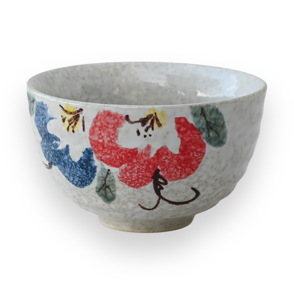 The Red and Blue Flowers Matcha Bowl features vibrant floral patterns on a white background, pairing perfectly with a bamboo matcha whisk for an ideal matcha tea set experience.