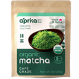 A pouch labeled "aprika" contains Organic Japanese Matcha Green Tea Powder, next to a bowl of vibrant matcha and visible certifications.