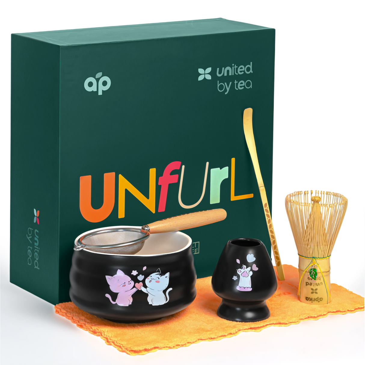The Black Unfurl Matcha Gift Set features a bowl, bamboo whisk, spoon, and sifter with charming cat designs, all beautifully displayed in front of a green box.