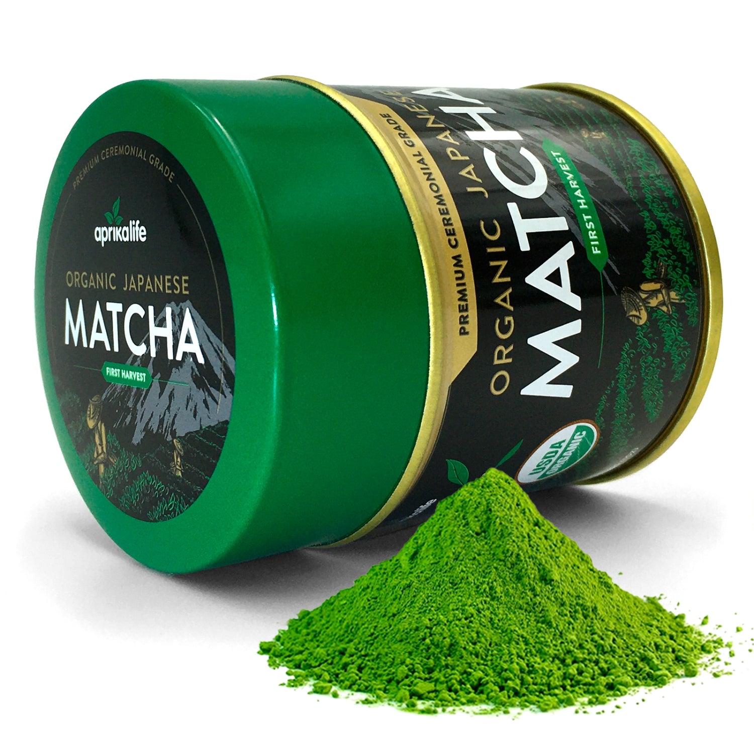 A green tin of Organic Japanese Ceremonial Grade Matcha Green Tea Powder sits elegantly with some spilled matcha, inviting you to experience its pure essence.