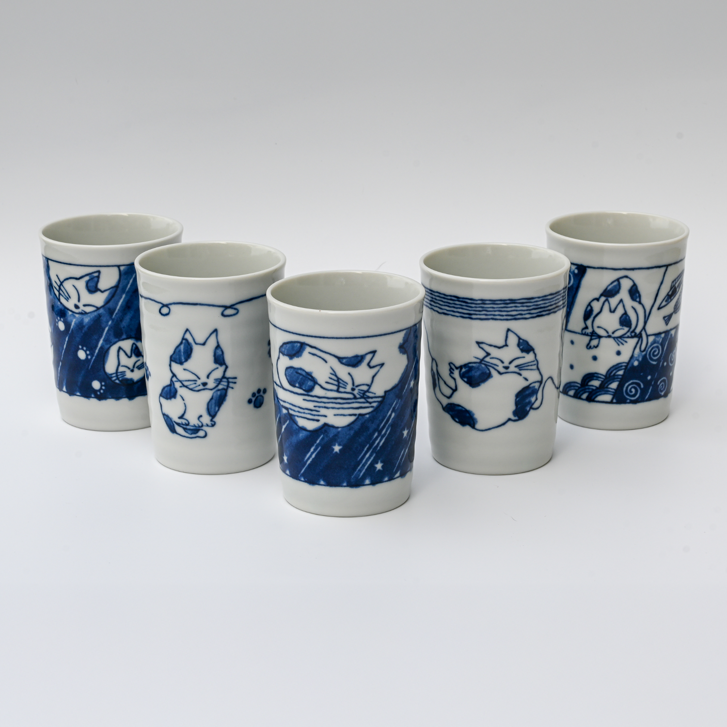 A Set of 5 Adorable Cat Tea Cups, Blue & White Mino-Ware (180ml/6oz each), is arranged in a semi-circle on a plain white background.